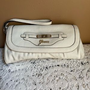 NWOT Guess White Clutch 10 inches wide by 5 inches in height.